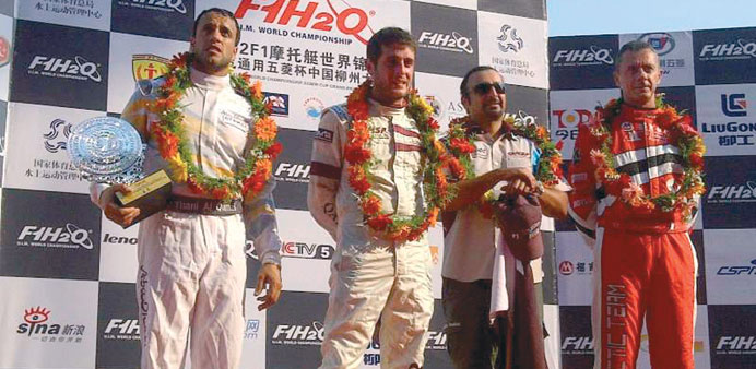 File photo of Alex Carella and Khalid bin Arhama al-Kuwari on the  podium in 2012.