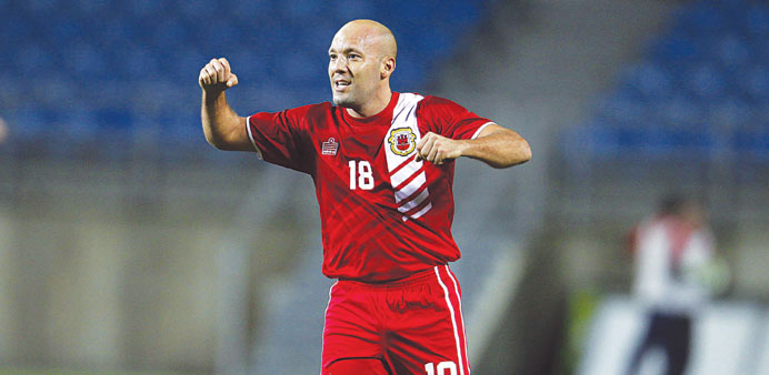 Gibraltar's Al Greene celebrates his team's draw against Slovakia in Tuesday's friendly match at Algarve stadium near Faro. (Reuters)
