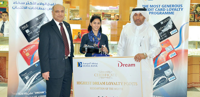 Doha Bank executives and customer at the presentation.