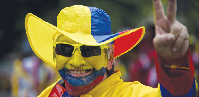 A Colombian national fan celebrates his teamu2019s win over Ivory Coast on Thursday.