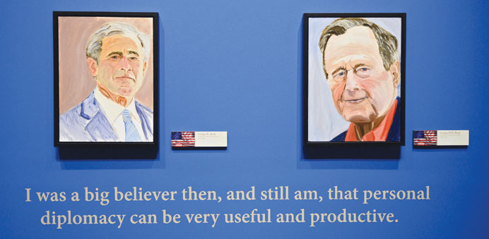 Portraits of former US presidents George W Bush and George HW Bush.