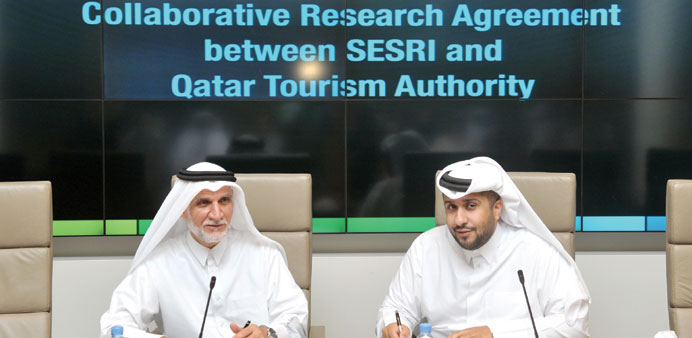 Dr Darwish al-Emadi and Hassan al-Ibrahim at the signing ceremony.