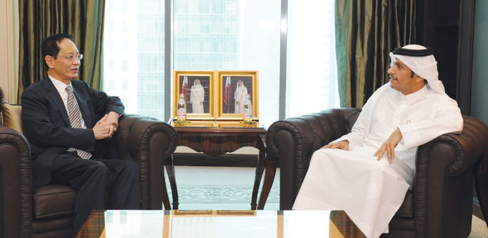 The minister meeting with the Singapore ambassador.