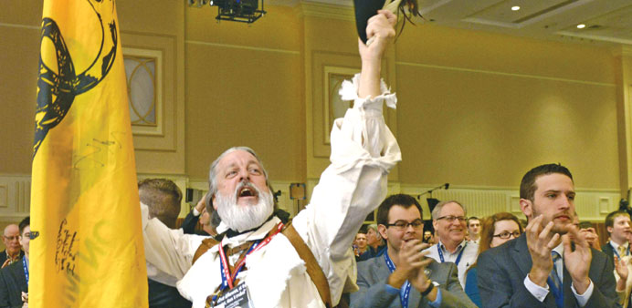 Vietnam veteran William Temple of Brunswick, Georgia, cheers in colonial garb at the opening of the Conservative Political Action Conference on Friday