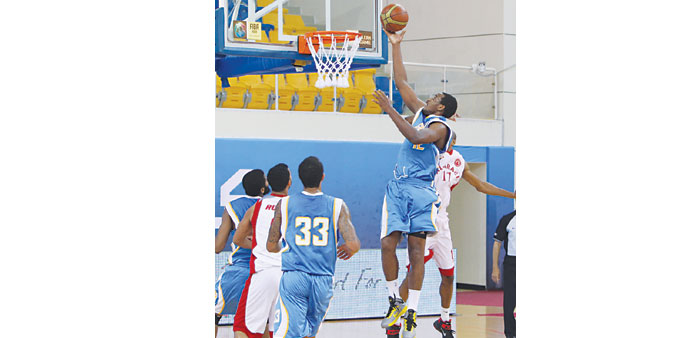 Gharafau2019s Emanuel Awako rises to score against Arabi during their HH The Emir Cup 2013 at Al Gharafa Sports Club yesterday.
