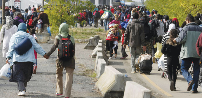 Migrants walk towards the Austrian border from Hegyeshalom, Hungary.