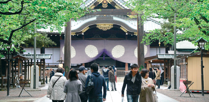 People visit Yasukuni Shrine during the first day of the three-day annual spring festival in Tokyo yesterday.