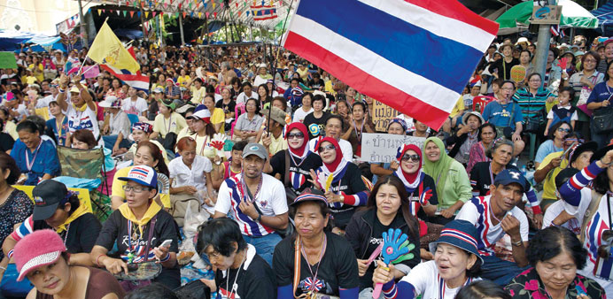 Anti-government protesters rally at Government House in Bangkok yesterday.