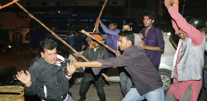 Supporters of Aam Aadmi Party and the Bharatiya Janata Party clash outside the office of BJP in the northern city of Lucknow yesterday.