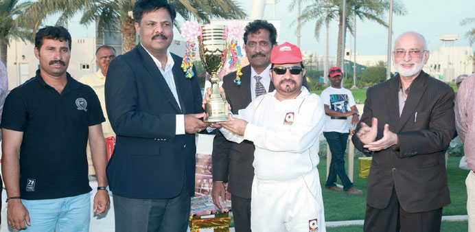 QALCO skipper Shahid Iqbal receives the winneru2019s trophy from Sharad Reddy, contracts manager of M Pallonji.