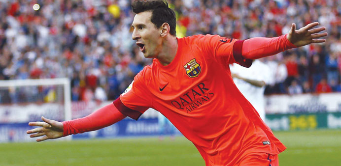 GOAL! Barcelona striker Lionel Messi celebrates after scoring against Sevilla on Saturday. (Reuters)