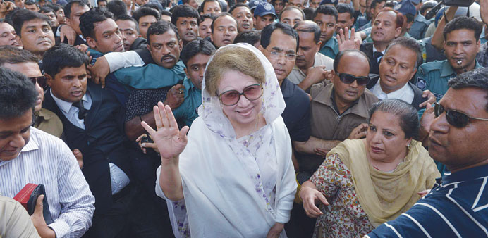 Former Bangladeshi prime minister and Bangladesh Nationalist Party (BNP) leader Khaleda Zia, centre, arriving for a court appearance in Dhaka yesterda