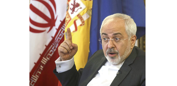 Zarif speaks to the media in Madrid yesterday.