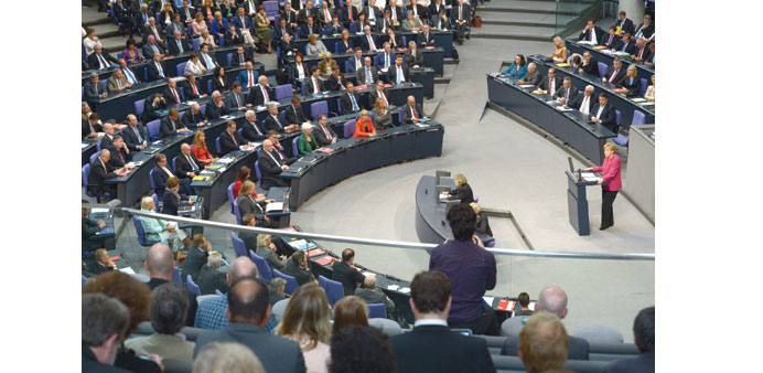 Merkel explaining the governmentu2019s position on the planned delivery of arms to the Kurds in Iraq during an extraordinary session of the German Parliam