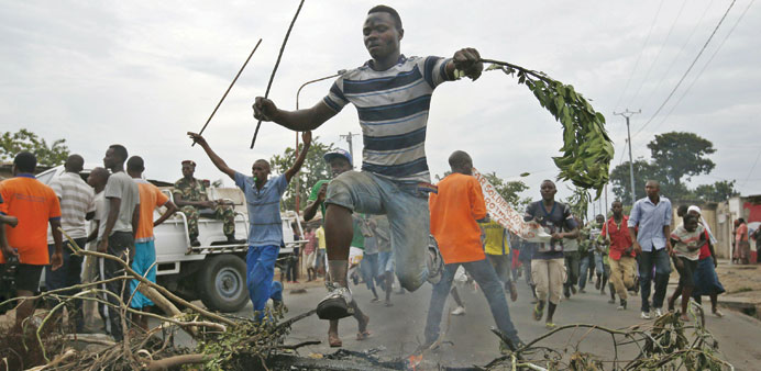 Protesters at a barricade during a rally against Burundi president Pierre Nkurunziza and his bid for a third term in Bujumbura, yesterday.