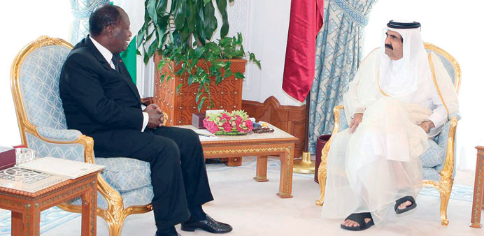 HH the Emir Sheikh Hamad bin Khalifa al-Thani with the President of Ivory Coast  Alassane Ouattara at the Emiri Diwan yesterday.