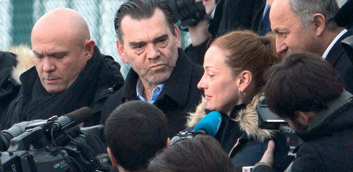 Cassez with French Foreign Minister Laurent Fabius (right) arrives at Roissy airport outside Paris after being freed from a Mexican prison the day bef