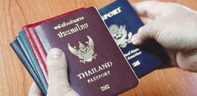 Some companies are accused by workers of retaining passports in their custody. 
