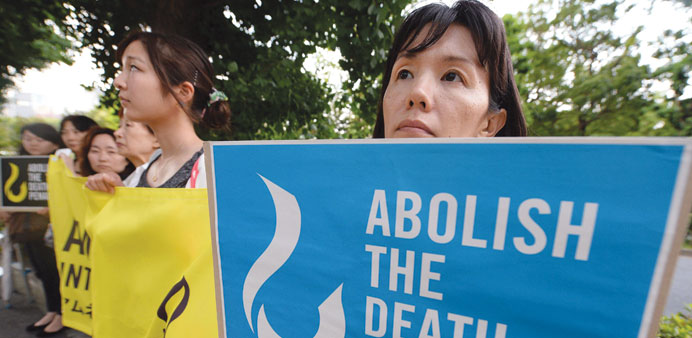 Members of civic groups hold banners denouncing the death penalty during a demonstration in front of the Justice Ministry in Tokyo.