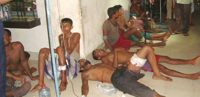 Injured Bangladeshi and ethnic Rohingya refugees from Myanmar receive treatment at a hospital in Teknaf.