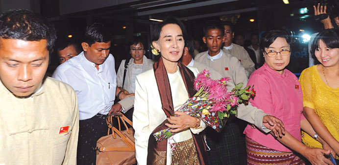    Myanmar democracy leader Aung San Suu Kyi arrives at the Yangon international airport before her departure to Japan yesterday.