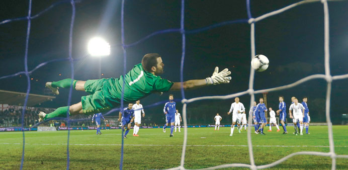 Englandu2019s Wayne Rooney (unseen) scores a free kick past San Marino goalkeeper Aldo Simoncini (C) during their 2014 World Cup qualifying match at the S
