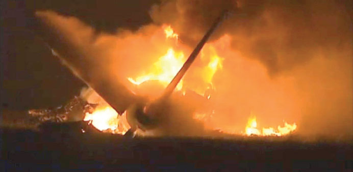 Flames rise from a UPS Airbus A300 cargo plane which crashed near the airport in Birmingham, Alabama yesterday.