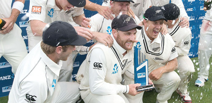 TRIUMPHANT: Captain of New Zealand Brendon McCullum (C) with Neil Wagner (R), Kane Williamson (L)  and others pose for a team photo in Wellington yest