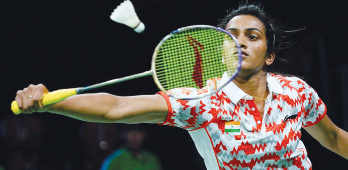Indiau2019s PV Sindhu competes against Spainu2019s Carolina Marin during the womenu2019s singles semi-final match at the 2014 BWF Badminton World championships in