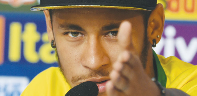 Injured Brazil forward Neymar gestures during a press conference in Teresopolis on Thursday. Brazil will face Netherlands today in the third place pla