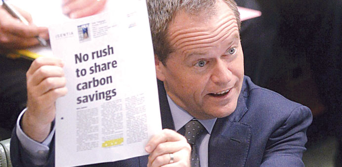  Australian opposition leader Bill Shorten displays a document during a debate in Parliament yesterday.
