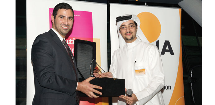 Al-Kuwari, right, receiving the Solar Pioneer award.