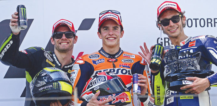 The three drivers (from left) u2014 Crutchlow, winner Marquez and third-placed Rossi u2014 celebrate on the podium after the race. (AFP/EPA)