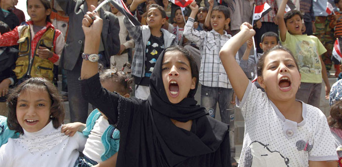 Children shout slogans during a protest in Sanaa over the conflict in Yemen yesterday.