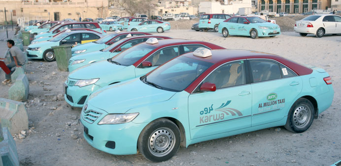A large number of taxis are seen waiting for customers on the ground near Doha Bus Station. PICTURE: Jayaram