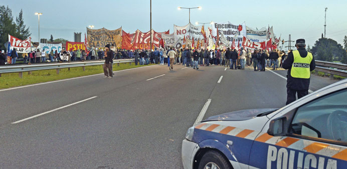 Demonstrators block the Pan-American Highway in Buenos Aires yesterday during the general strike in Argentina.