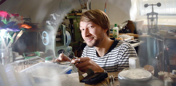 * Andreas Meinhardt, a German inventor of illusions, at work in his magic workshop in Stuttgart, Germany. He exports his tricks worldwide.