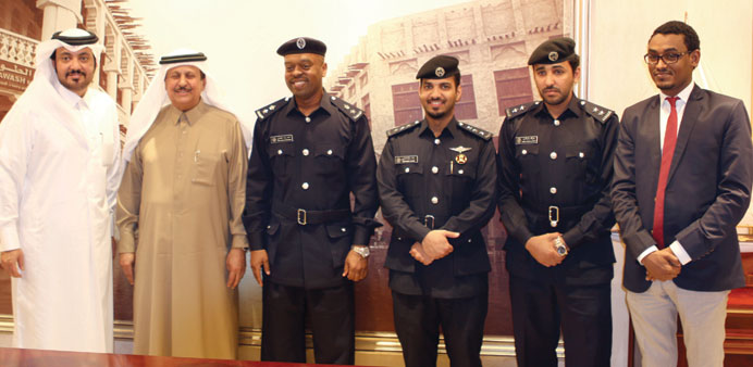Community Policing officials with Sheikh Thani bin Abdullah al-Thani at the honouring ceremony. 