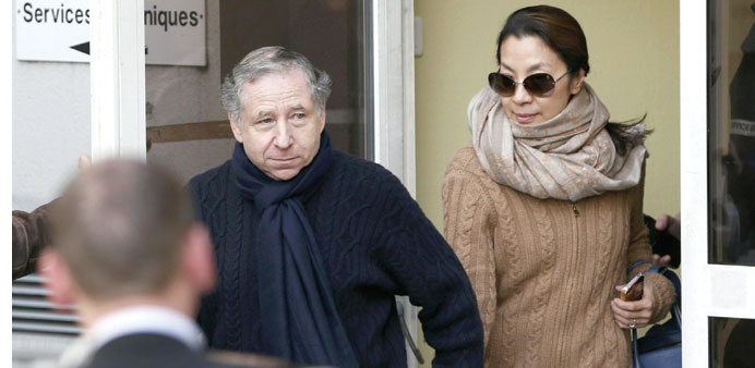 FIA president Jean Todt (left) and his girlfriend Michelle Yeoh leave the CHU hospital after visiting Michael Schumacher in Grenoble, French Alps, yes