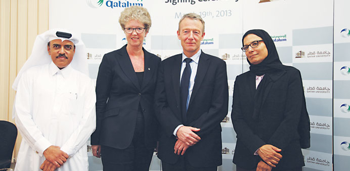 Qatalum officials along with the QU president during an announcement.