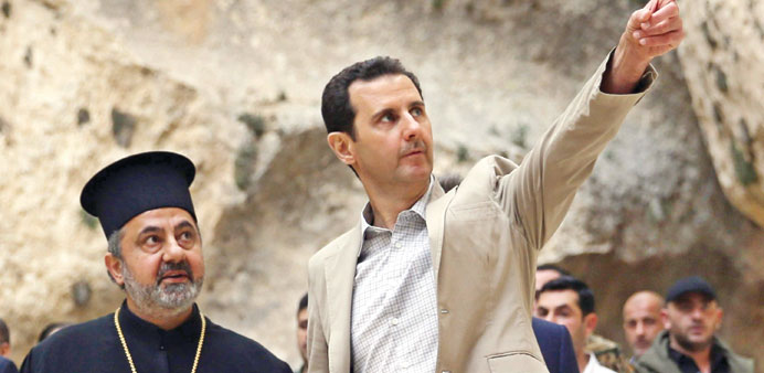Assad visits the ancient Christian town of Maalula yesterday.