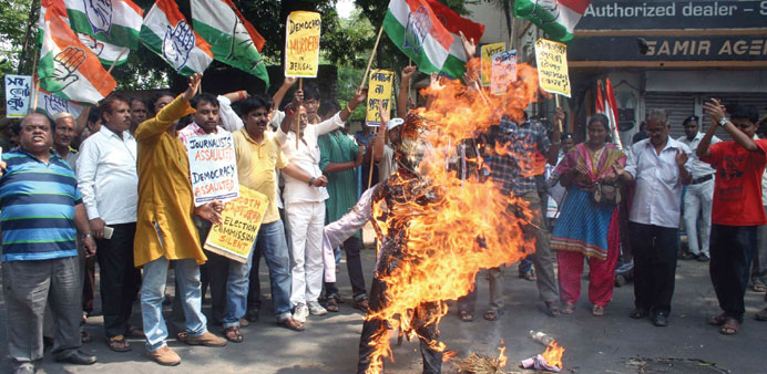 Congress activists stage a demonstration against West Bengal state Election Commission in Kolkata yesterday.