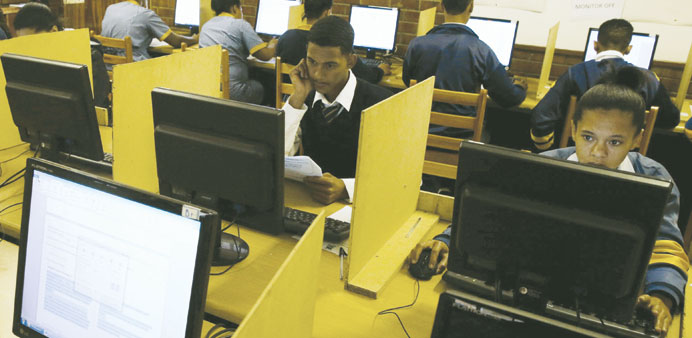 Students use computers to study at Elswood Secondary School in Cape Town.