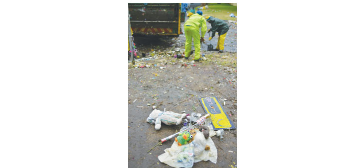 Workers clean up outside the Houghton Home of late former president Nelson Mandela in Johannesburg yesterday.