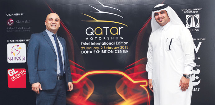 Haidar and al-Saadi present the new logo of Qatar Motor Show yesterday. PICTURE: Noushad Thekkayil