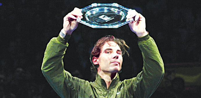 Rafael Nadal holds up the runners-up shield in London on Monday. (AFP)