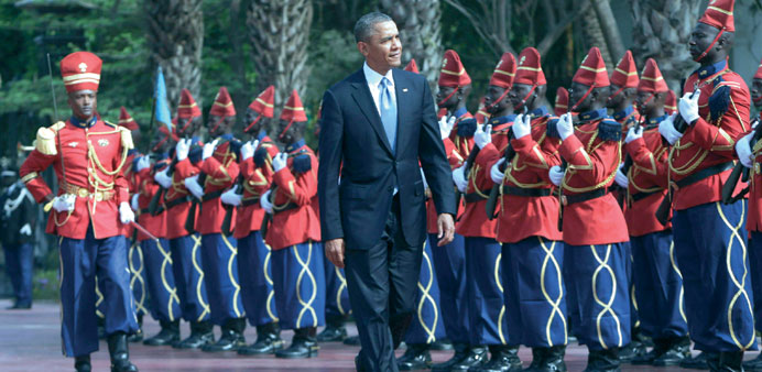 US President Barack Obama is greeted by a honor guard at the presidential palace yesterday in Dakar, Senegal.