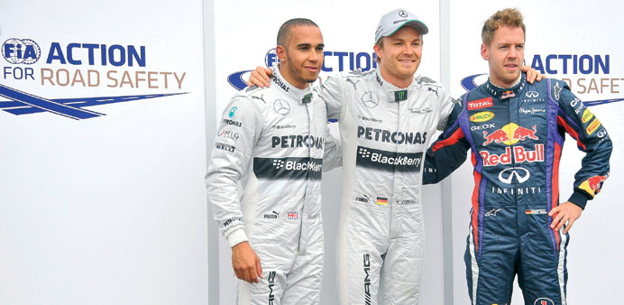 Mercedesu2019 Nico Rosberg (centre) will start on pole, team mate Lewis Hamilton (left) second while Red Bullu2019s Sebastian Vettel will start third today. (