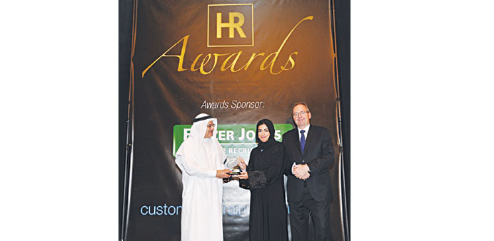Sharoq Ibrahim al-Malki receiving the award in Dubai.