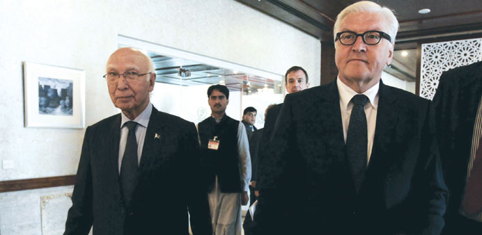 German Foreign Minister Frank-Walter Steinmeier (right) and Pakistanu2019s national security adviser Sartaj Aziz arrive for a news conference at the forei